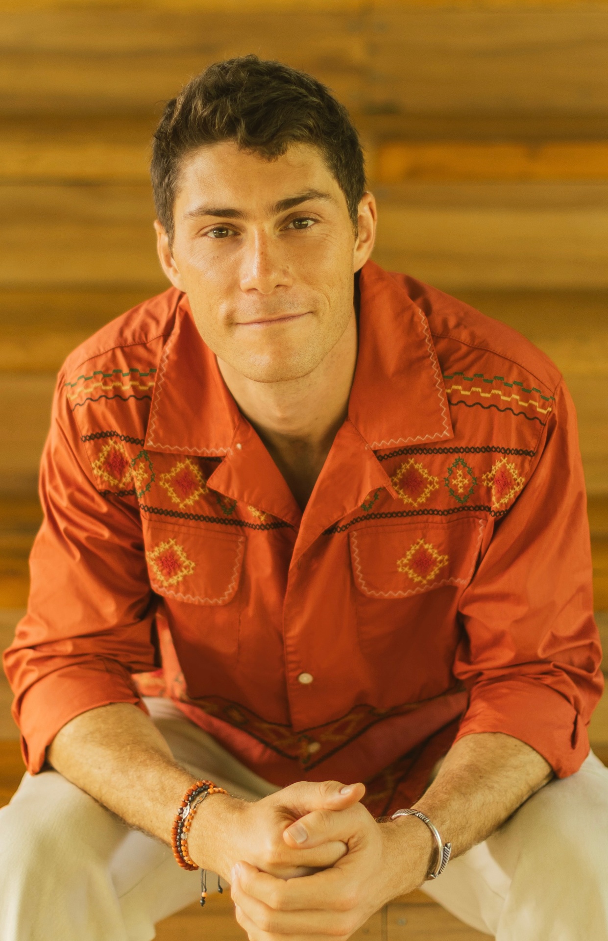 Adam Bendell in a rust embroidered shirt